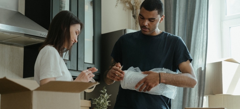 two people packing