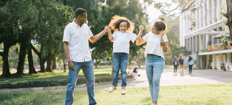 family playing with their daughter as an example of how safe living in Glendale is