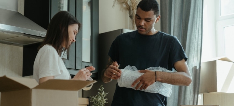 two people packing