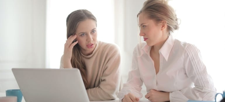Picture of two women trying to choose the right neighborhood when relocating to SoCal